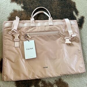 NWT Calpak small garment bag in dusty pink/almond color